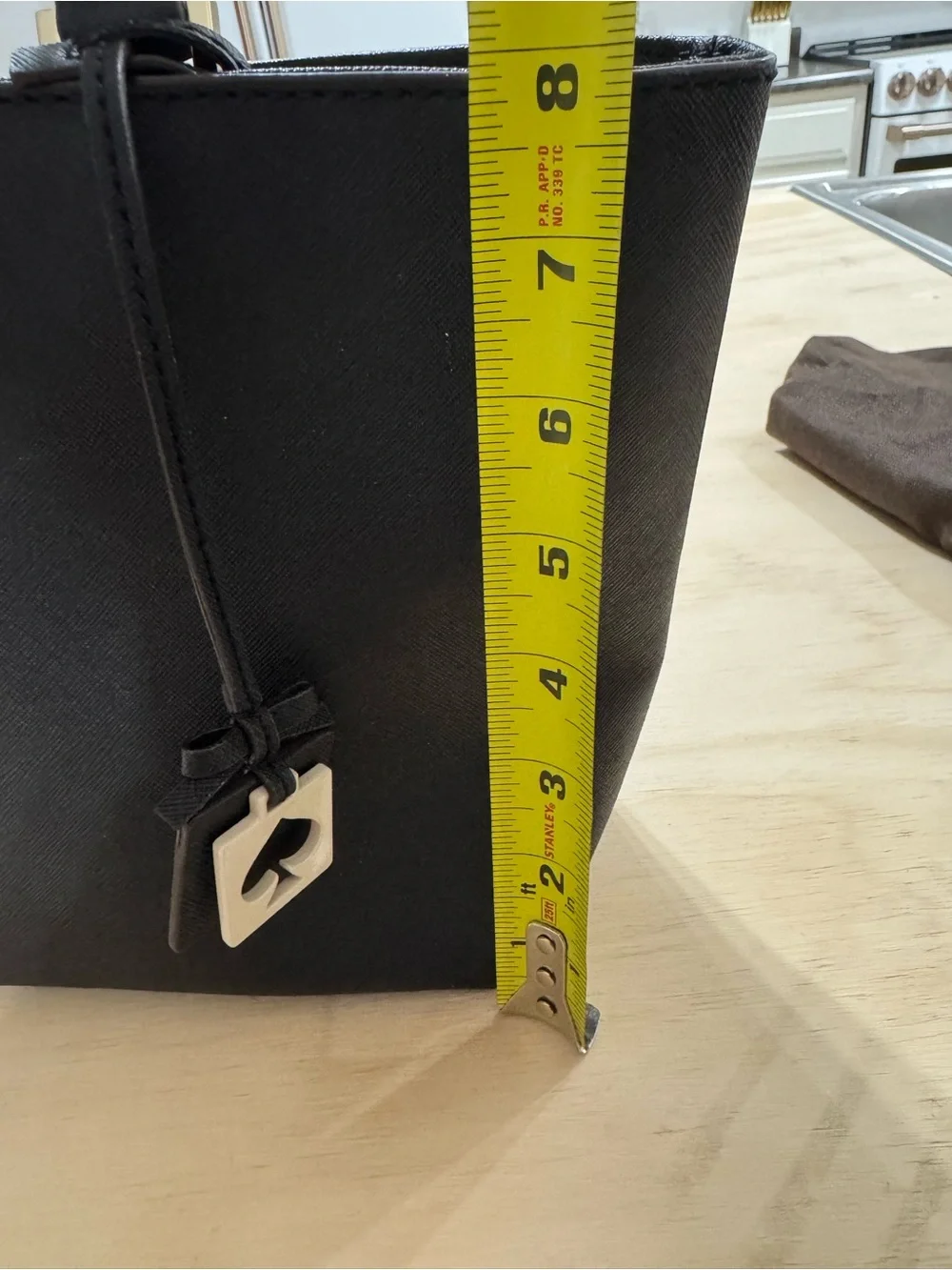 kate spade black saffiano tote with gold accents